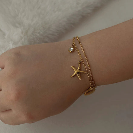 Bracelet Dubai acier inoxydable doré étoile de mer et coquillage - o-dace.com