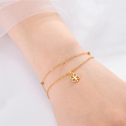Bracelet Hanoi en acier inoxydable doré avec trèfle porte-bonheur. - O-dace.com