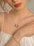 Collier Bandung en acier inoxydable doré avec pendentif solaire. O-dace.com