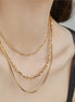 Collier Makassar en acier inoxydable doré avec chaînes modernes. O-dace.com