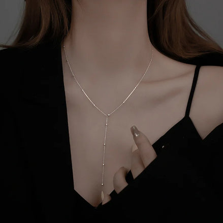 Collier Tegal en acier inoxydable doré chaîne Y élégante. O-dace.com